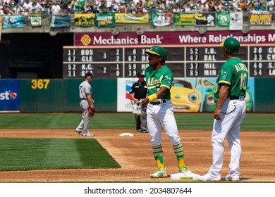 Oakland, California - August 28, 2021: Oakland Athletics' Tony Kemp #5 Stands On First Base With First Base Coach Mike Aldrete #10 During A Game Against The New York Yankees At RingCentral Coliseum.