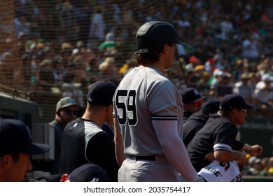 Oakland, California - August 28, 2021: New York Yankees Designated Hitter Luke Voit #59 Watched From The Dugout During A Game Against The Oakland Athletics At RingCentral Coliseum.