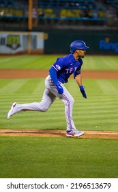 Oakland, California - July 23, 2022: Texas Rangers Second Baseman Marcus Semien Runs To First Base During A Game Against The Oakland Athletics At The Oakland Coliseum.