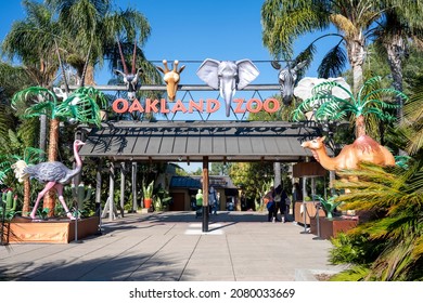 Oakland, California - November 12, 2021: Entrance to the Oakland Zoo on a sunny day, with animal representations and plants decorating the walkway.