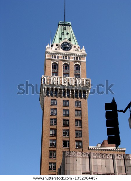 Oakland,\
Calif./USA-May 11, 2012: The Tribune Tower, in Oakland, still\
sports its namesake neon sign although the newspaper permanently\
moved out of the historic building in 2007.\
