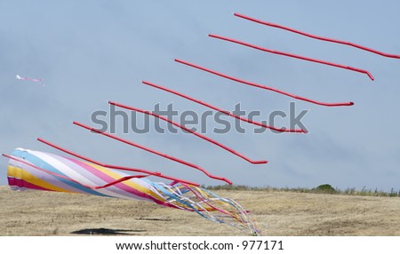 Similar – a colorful garland blows in the wind on the north sea