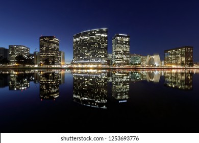 Oakland Skyline Panorama With Lake Merritt Reflections At Blue Hour. Oakland, Alameda County, California, USA.