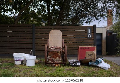 Oakleigh, VIC / Australia - Aug 27 2018: Chair And Miscellaneous Hard Rubbish Put On Curbside For Council Annual Collection