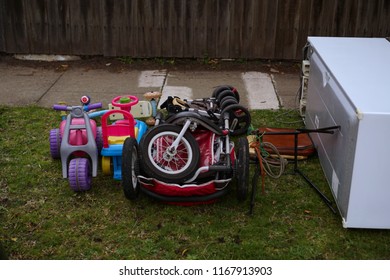 Oakleigh, VIC / Australia - Aug 27 2018: Children Bikes And Miscellaneous Hard Rubbish Put On Curbside For Council Annual Collection