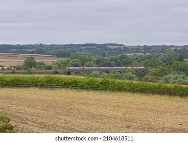 OAKLEY, BEDFORDSHIRE, UK - AUGUST 21, 2010: Looking down from Oakley, an East Midlands Trains Meridian Class 222 crosses the Ousebank Viaduct, with the 08:37 Leeds to London St. Pancras service.