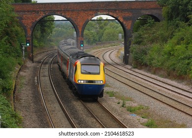 OAKLEY, BEDFORDSHIRE, UK - AUGUST 21, 2010: East Midlands Trains (HST) Class 43 No. 43061 speeds south through Oakley, with the 07:34 Leeds to St Pancras service.