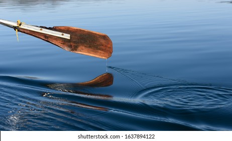 The Oar Made Some Ripples Across The Blue Water