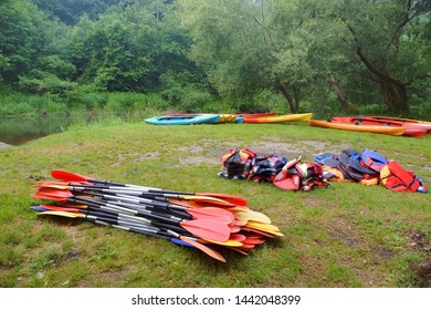 the oars from the canoes on the shore, preparing for the Canoeing - Powered by Shutterstock