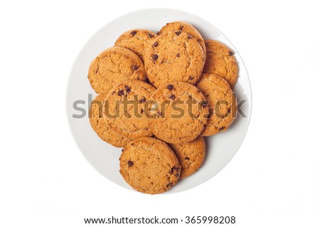 Oat cookies in plate isolated on white background, top view. Sweet bakery products. Round cookies in a plate.