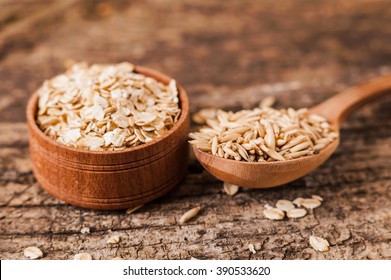 Oat ears of grain on a wooden table, oatmeal. Bounteous harvest. A  Healthy fresh Dry Oat meal  - Shutterstock ID 390533620