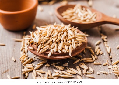 Oat ears of grain on a wooden table, oatmeal. Bounteous harvest. A  Healthy fresh Dry Oat meal  - Shutterstock ID 391184752