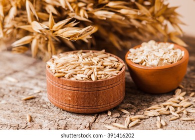 Oat ears of grain on a wooden table, oatmeal. Bounteous harvest. A  Healthy fresh Dry Oat meal  - Shutterstock ID 391416202