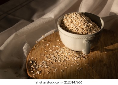 Oat Fakes On Wood Chopper In White Tea Cup