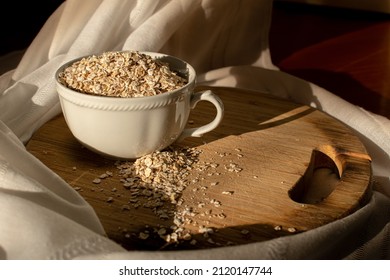 Oat Fakes On Wood Chopper In White Tea Cup