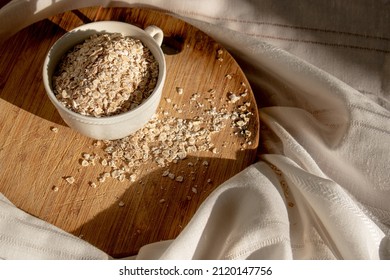 Oat Fakes On Wood Chopper In White Tea Cup