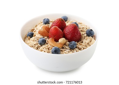 Oat Flakes In Bowl With Berries And Nuts Isolated On White