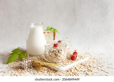 Oat Flakes, Out Milk And Rasberry On A Table. Plant-based Healthy And Vegetarian Eating And Drink. Selective Focus, Close Up