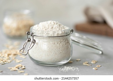 oat flour in a glass jar on a white table, close up - Powered by Shutterstock