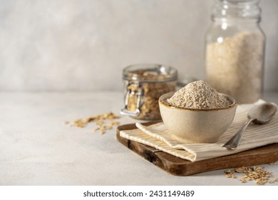 Oat flour and whole oats in a spoon. Gluten free flour, oats, home baking - Powered by Shutterstock