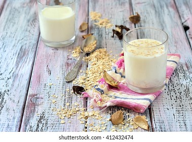 Oat Milk In A Glass On The Table With Dried Fruit