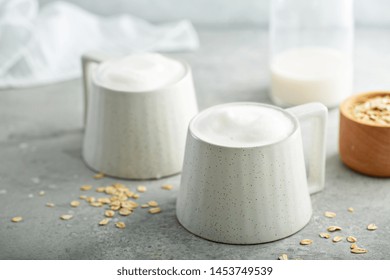 Oat Milk Latte With Thick Foam In Ceramic Mugs