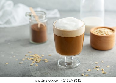 Oat Milk Latte With Thick Foam In A Glass