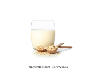 Oat Milk And Oatmeels In Spoon Isolated On White Background