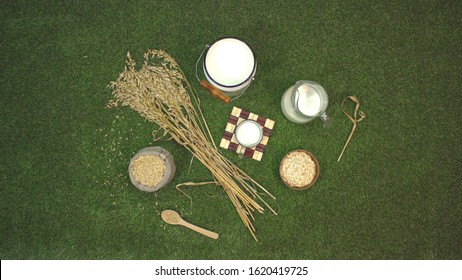 Oat Milk And Oats On The Lawn. Top View. 