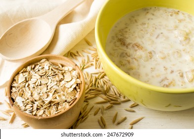 Oat Milk Porridge In A Yellow Bowl On The Table With Oats