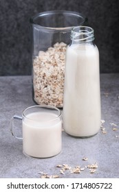 Oat Milk. Pouring The Strained Oat Milk Into A Glass Jar. Process Of Making Oat Milk. 