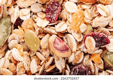 Oat muesli with nuts, dried berries and seeds close-up top view - Powered by Shutterstock