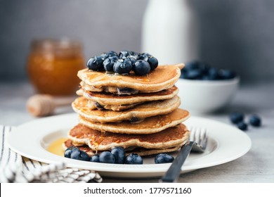 Oat Pancakes With Blueberries And Honey On White Plate. Stack Of Healthy Vegetarian Pancakes, Low Carb Paleo Pancakes