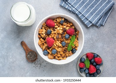 Oat raisin granola with fresh summer berries in a bowl, top view. Concept of healthy breakfast food, clean eating, dieting - Powered by Shutterstock