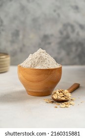 Oat Wholegrain Flour In Wooden Bowl. Gluten - Free Flour Concept