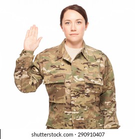 Oath Of Enlistment. Attractive Female Army Soldier Wearing Multicam Camouflage.