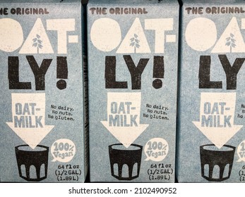 Oat-Ly Brand Original Oat Milk Oatly Cartons On Shelf Of Diary Section Of Grocery Store - San Jose, California, USA - 2022