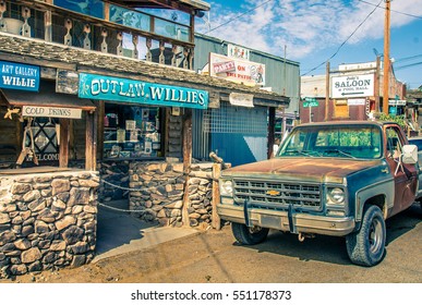 OATMAN, Arizona - September 10, 2015: Modern Wild West Scenery With Tourist Shops And Old Rusty Pickup Car In Oatman. Made During A Motorcycle Road Trip Through The United States - Vintage Color Look