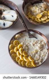 Oatmeal with bananas for breakfast. - Shutterstock ID 1468149302