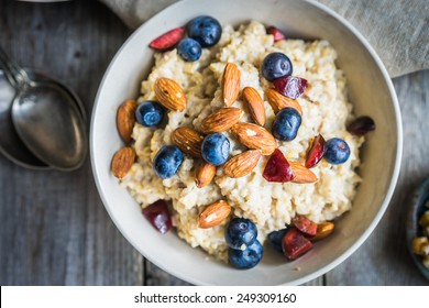 Oatmeal with berries and nuts - Shutterstock ID 249309160