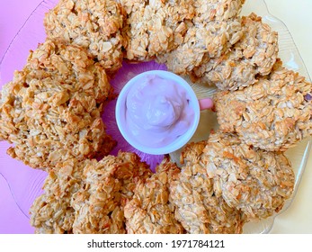 Oatmeal Cookies, Cooking At Home, Healthy Food, Round Shape, Yellow-purple Background. Blueberry Sauce In Small Cup Pink