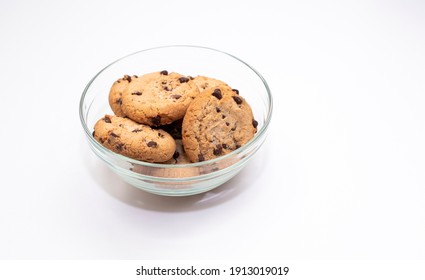 Oatmeal Cookies In A Glass Bowl, Baked Goods On A White Background. 