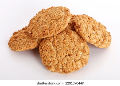 Oatmeal, fig, hazelnut, pistachio and sesame cookies on a white background. Enjoyable snack. - Shutterstock ID 2201390449