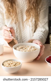 Oatmeal Porridge Bowl In Female Hands. Clean Eating, Dieting, Vegetarian Breakfast Food For Weight Loss Concept