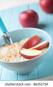 Oatmeal Porridge With Cinnamon And Apple In A Bowl