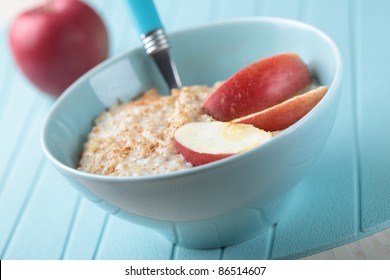 Oatmeal Porridge With Cinnamon And Apple In A Bowl