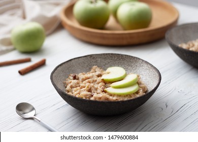 Oatmeal porridge with fresh apple for breakfast on white background - Powered by Shutterstock