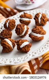 Oatmeal Pumpkin Creme Pies With Cream On White Plate