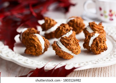 Oatmeal Pumpkin Creme Pies With Cream On White Plate