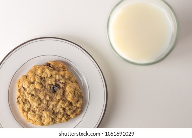 Oatmeal Raisin Cookie With A Glass Of Milk. Top Down View.